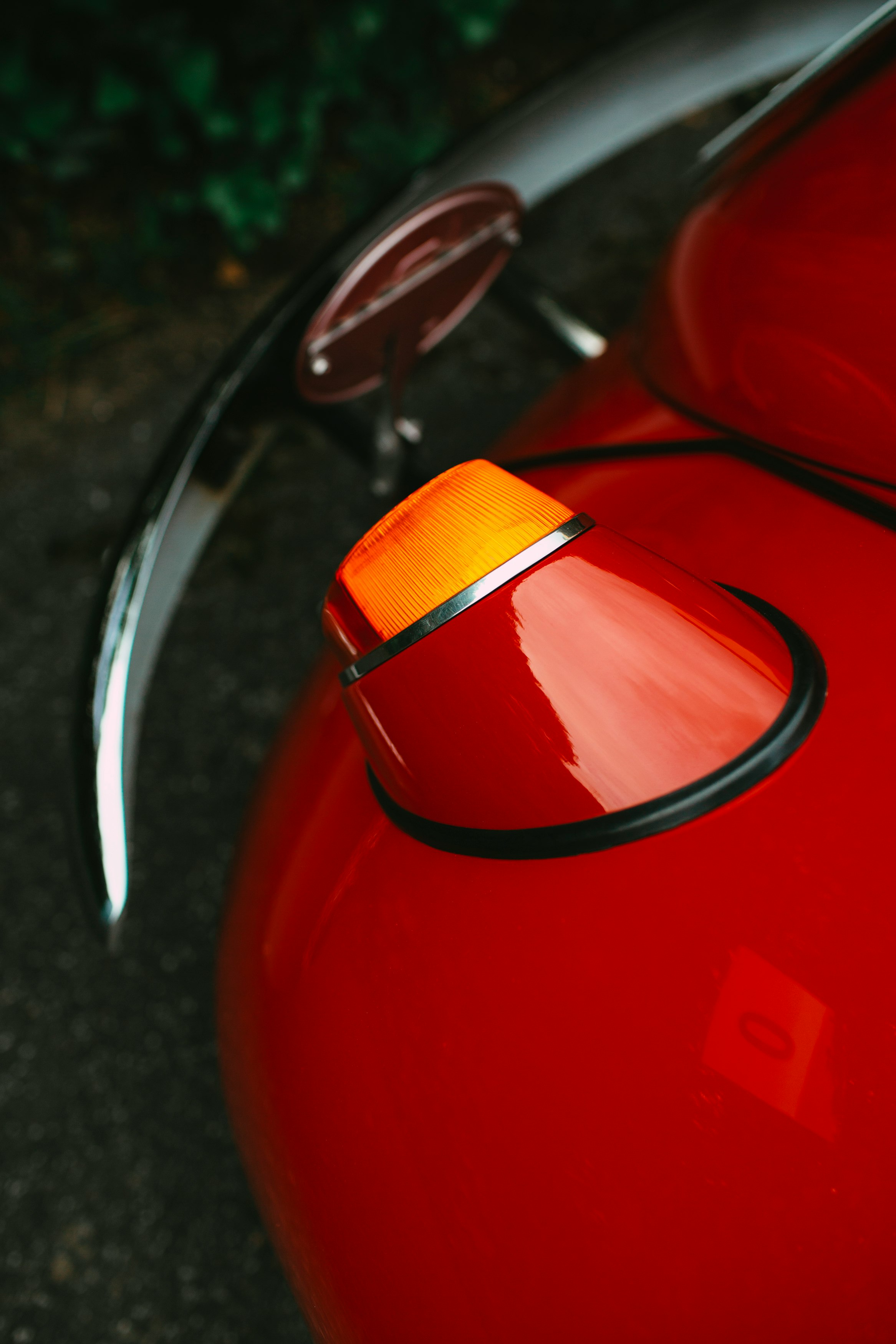 red and silver car side mirror